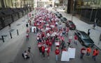Dozens of members of the Minnesota Nurses Association marched from U.S. Bank headquarters to Wells Fargo in Minneapolis on Nov. 2, 2022.