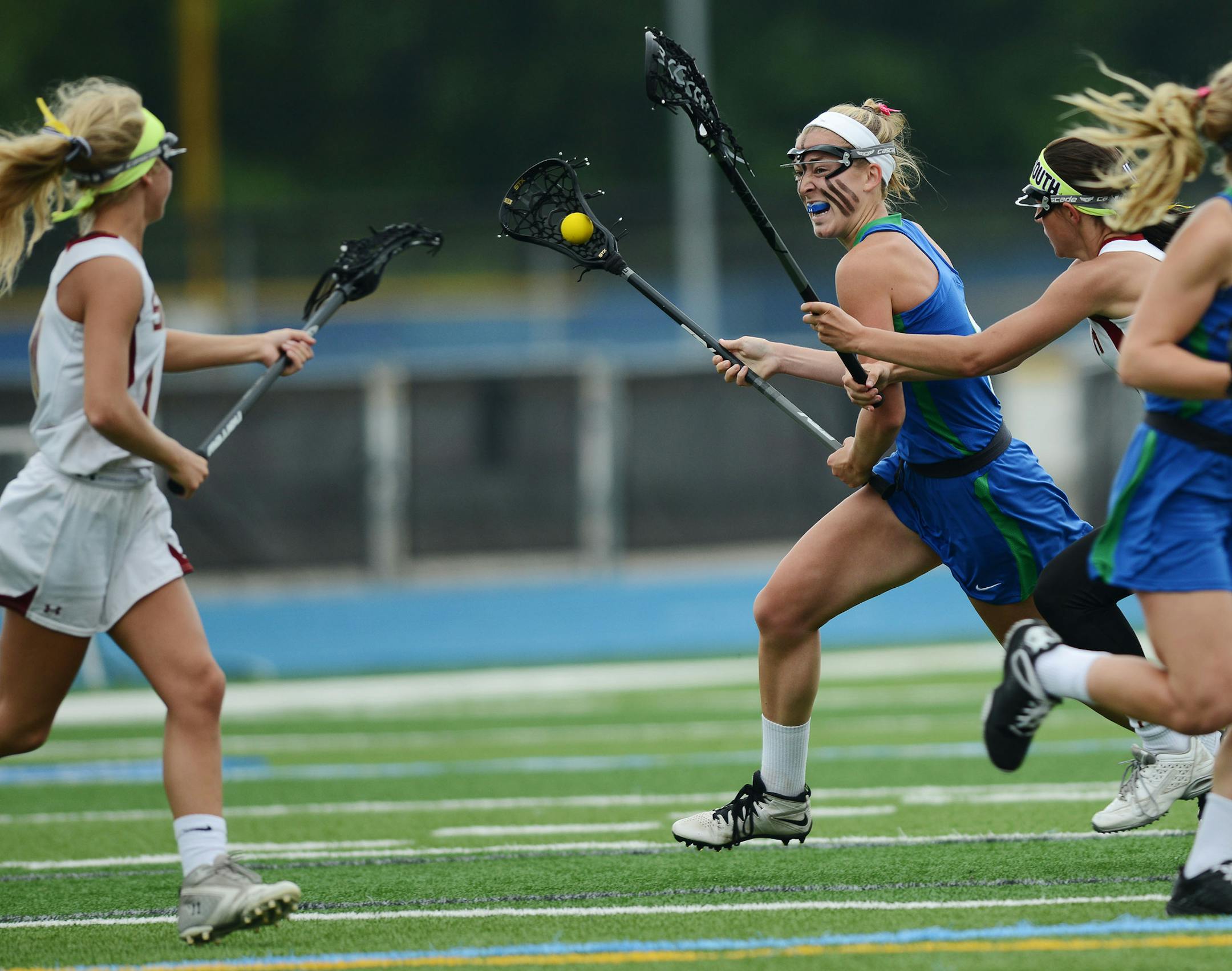 Blake's Annie Lyman moved the ball across the field against the defense of Lakeville South players in the 1st half Thursday evening in Minnetonka. ] RACHEL WOOLF ï rachel.woolf@startribune.com The Blake School met Lakeville South in a girls state lacrosse tournament semifinal game at Minnetonka High School in Minnetonka Thursday evening, June 11, 2015.
