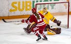 Wisconsin left defender Grace Bowlby (13) scored on University of Minnesota Duluth goaltender Maddie Rooney (35) on a power play in the second period 
