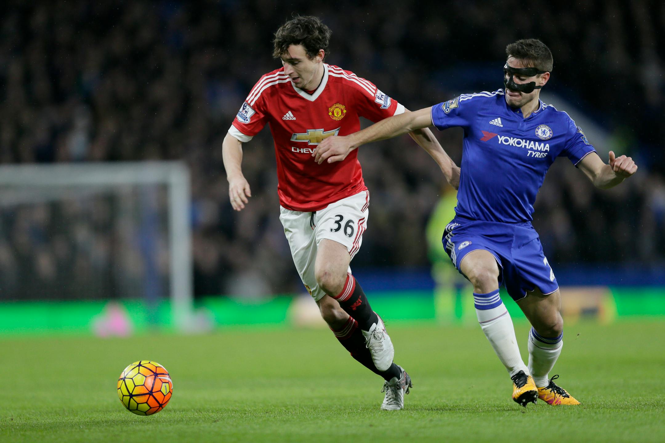 Chelsea's Cesar Azpilicueta, right, competed for the ball with Manchester United's Matteo Darmian during the English Premier League soccer match at Stamford Bridge stadium in London on Sunday. The game ended in a 1-1 draw.