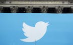 FILE- In this Nov. 7, 2013, file photo, a Twitter sign is draped on the facade of the New York Stock Exchange before its IPO in New York. Twitter repo