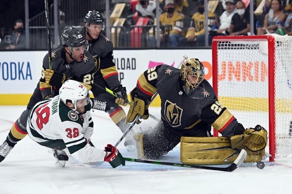 Vegas Golden Knights goaltender Marc-Andre Fleury (29) defends against Minnesota Wild right wing Ryan Hartman (38) during the first period