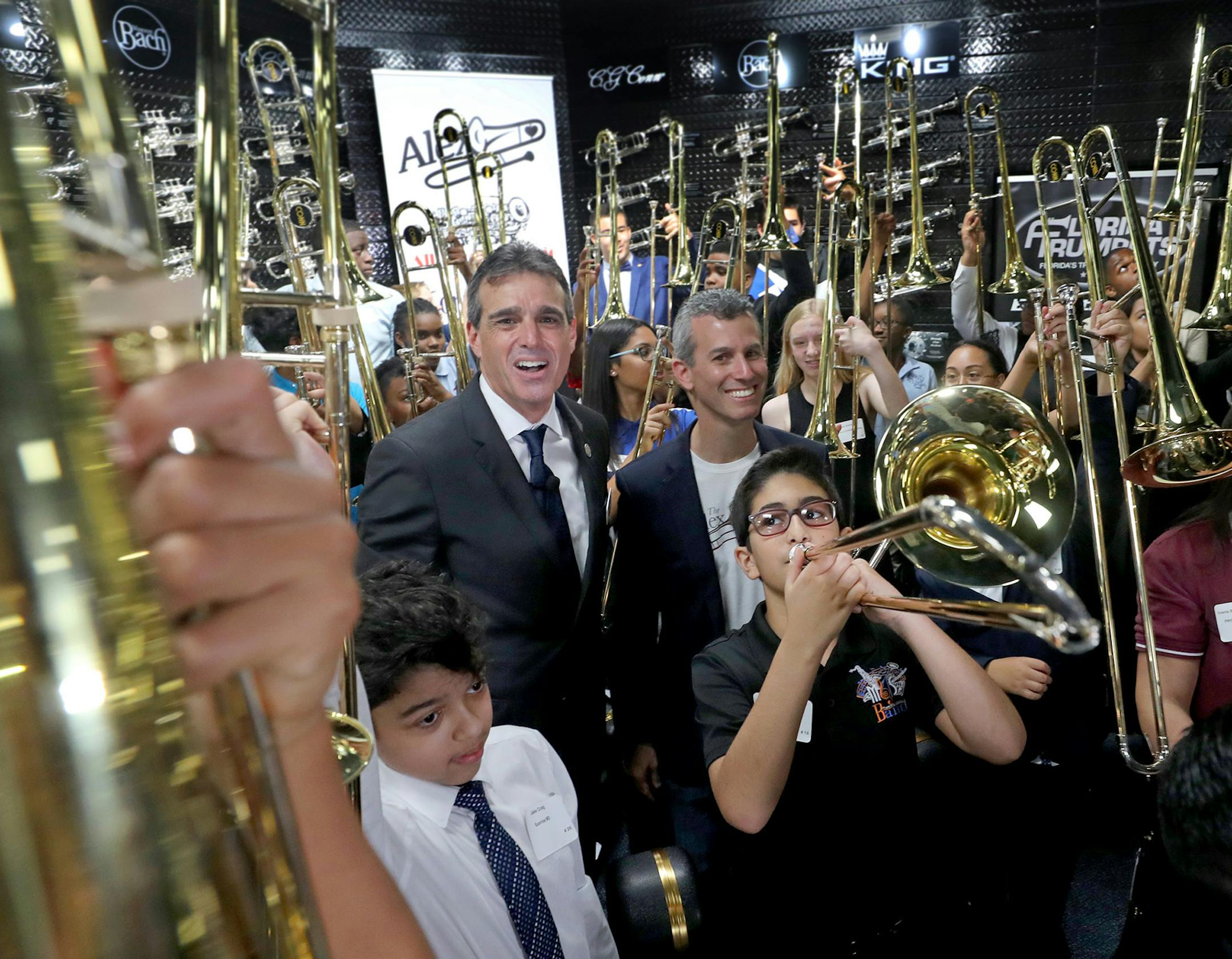 Fred Schiff, the owner of All County Music and Max Schachter, the father of Alex Schachter, stands with the recipients of the Alex Tribute Trombones on May 11, 2019. All County Music honored the life of Alex Schachter, a Marjory Stoneman Douglas shooting victim, by presenting $50,000 worth of specially designed Alex Tribute Trombones to 50 band students from 50 different south Florida schools. (Mike Stocker/Sun-Sentinel/TNS)