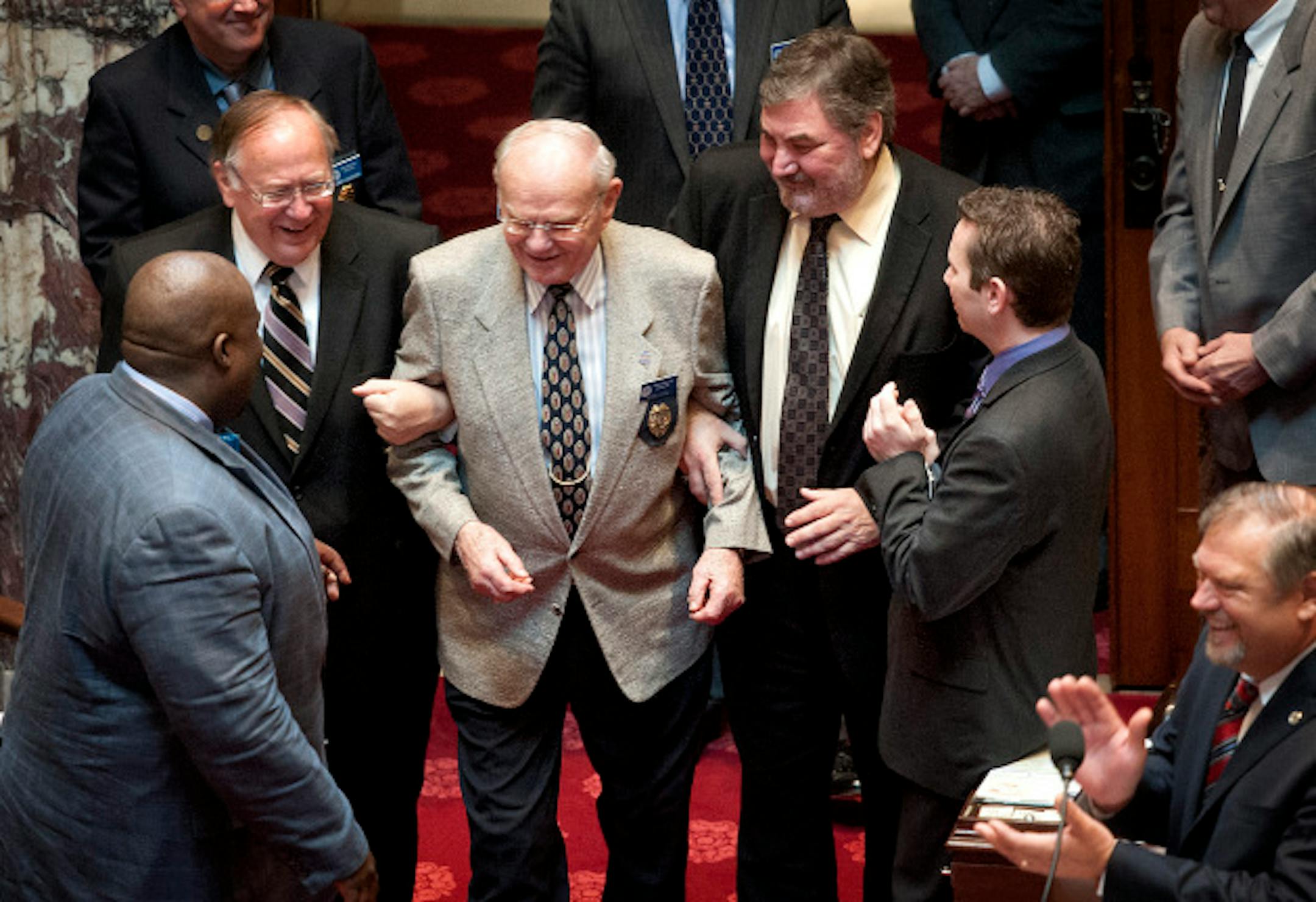 Sens. David Senjem  and Rod Skoe had to "kidnap" Sergeant-at-Arms Herb Cook who was reluctant to come onto the Senate floor.  Senators then serenaded him singing "Happy Birthday."  Monday, May 20, 2013  ]   GLEN STUBBE * gstubbe@startribune.com