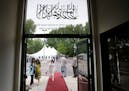People mingle outside of the Nusrat Mosque prior to the start of an inauguration Saturday, May 23, 2015, for the Mosque in Coon Rapids, the first and 