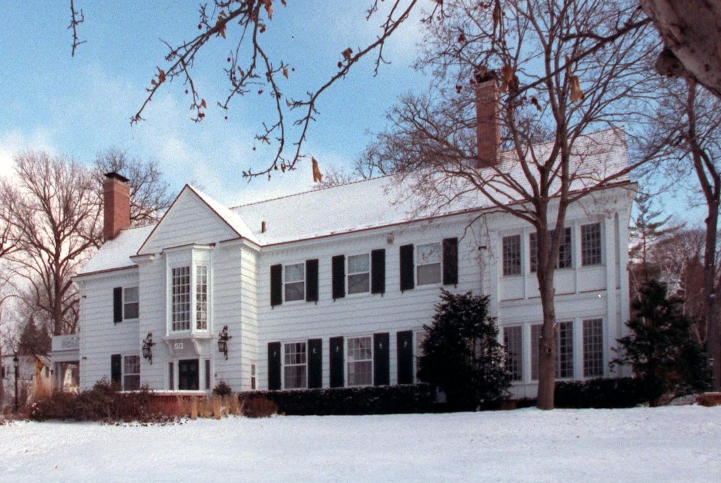 Exterior view of Eastcliff, the University of Minnesota president's house, with snow on the ground.