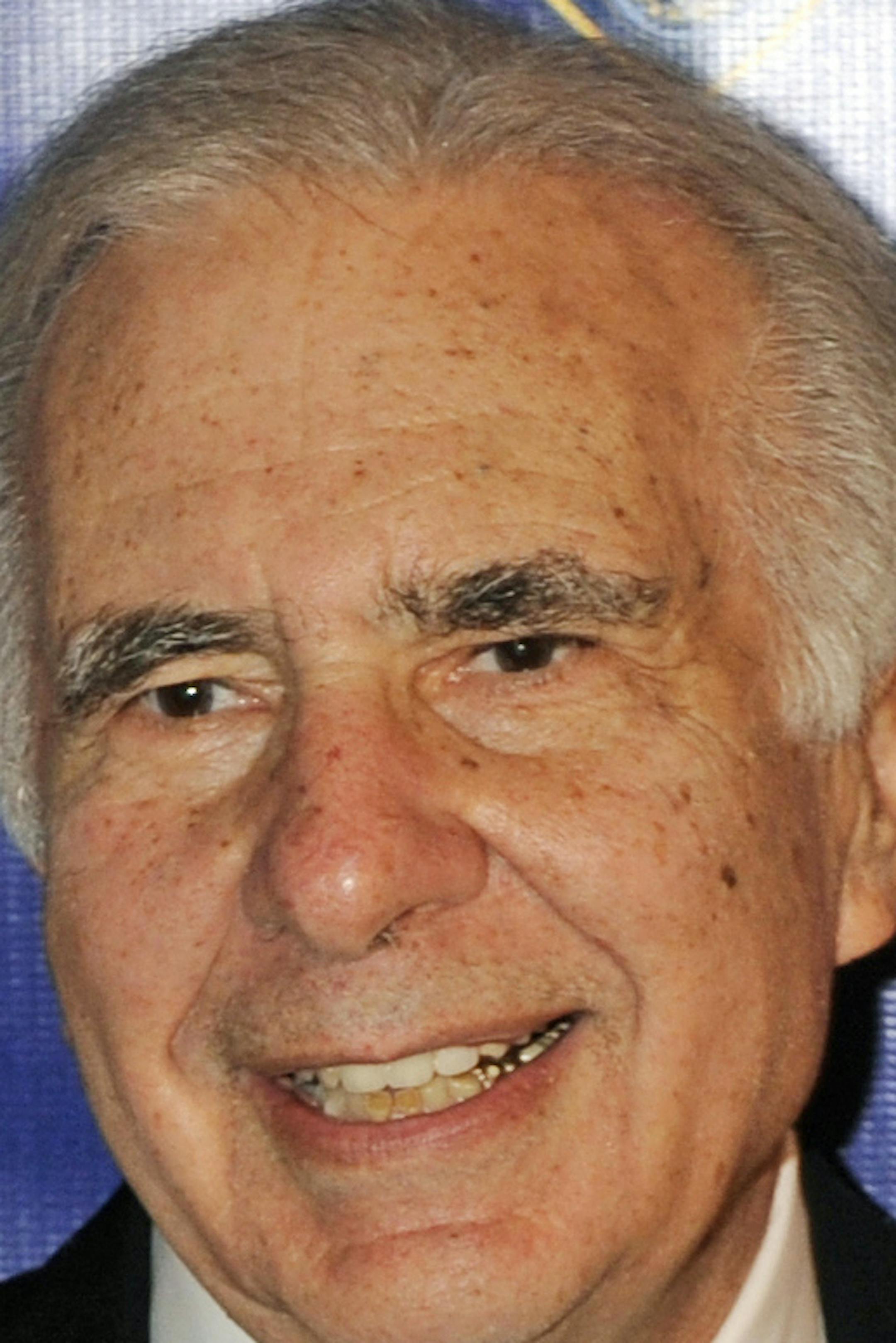 FILE - In this March 16, 2010 file photo, financier Carl Icahn poses for photos upon arriving for the 32nd annual New York City Police Foundation Gala in New York. Under a deal announced Thursday, April 10, 2014, Icahn is backing down from his push to remake eBay, settling an acrimonious dispute just ahead of what promised to be an awkward annual shareholders meeting. (AP Photo/Henny Ray Abrams, File)