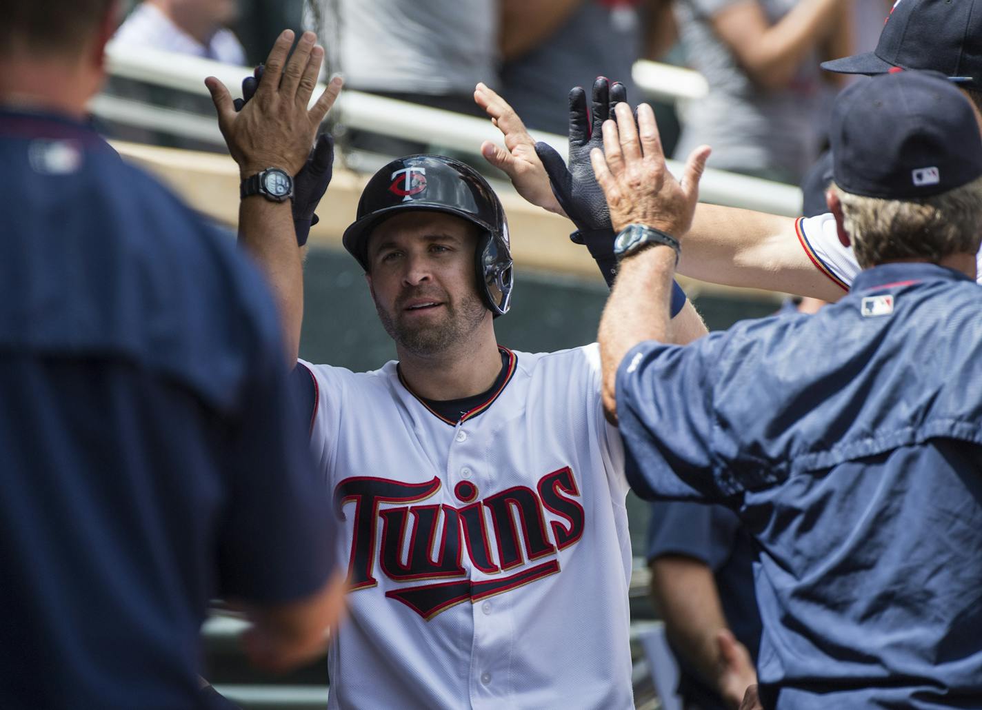 Minnesota Twins second baseman Brian Dozier (2) celebrated with teammates in the dugout after hitting a solo home run to bring the score 5-3 in the fifth inning at Target Field on Sunday. ] Isaac Hale &#x2022; isaac.hale@startribune.com The Minnesota Twins played the Chicago White Sox at Target Field in Minneapolis, MN, on Sunday, July 31, 2016.