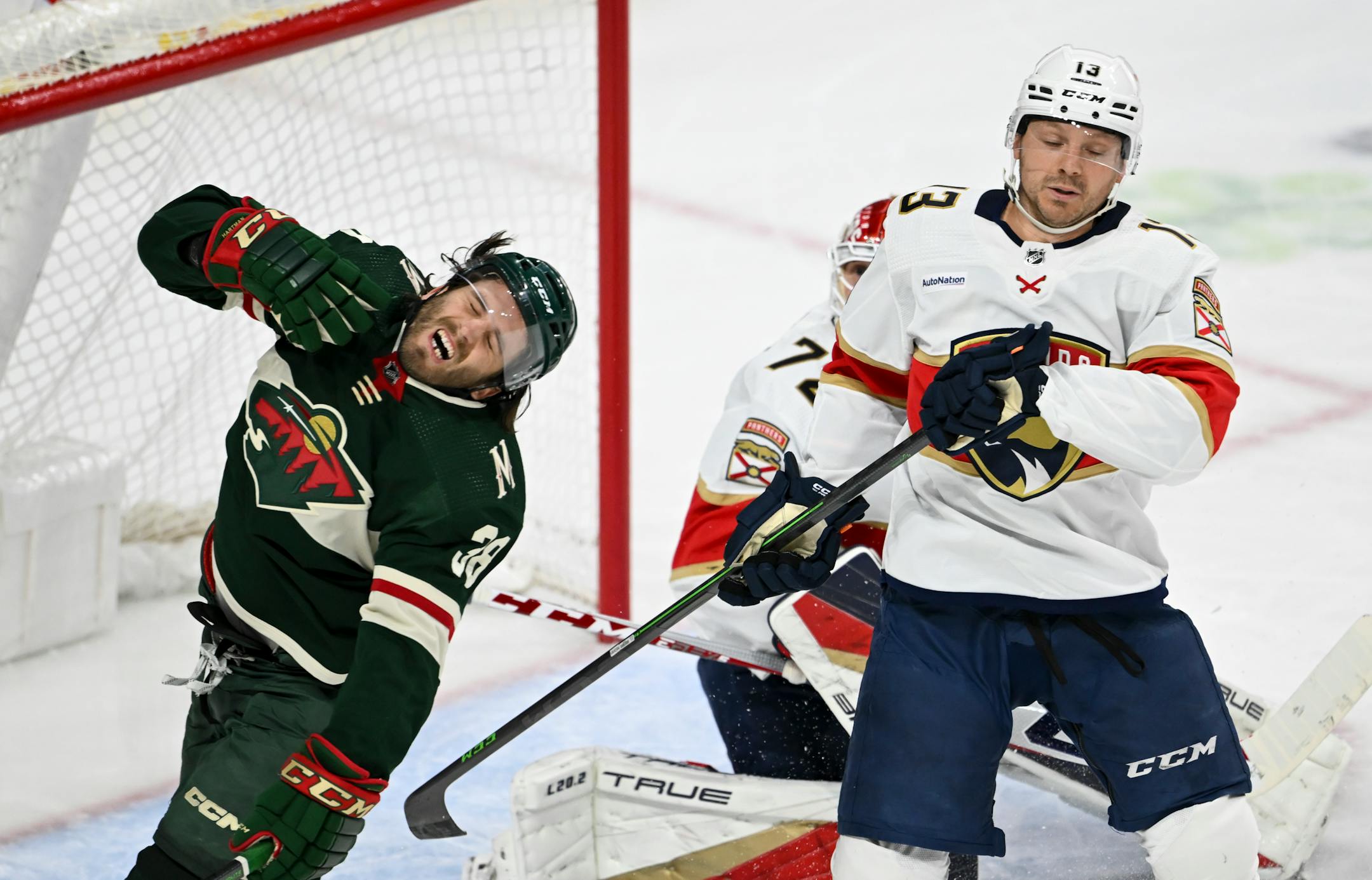 Florida Panthers center Sam Reinhart (13) high sticks Minnesota Wild right wing Ryan Hartman (38), leading to a powerplay during the second period.