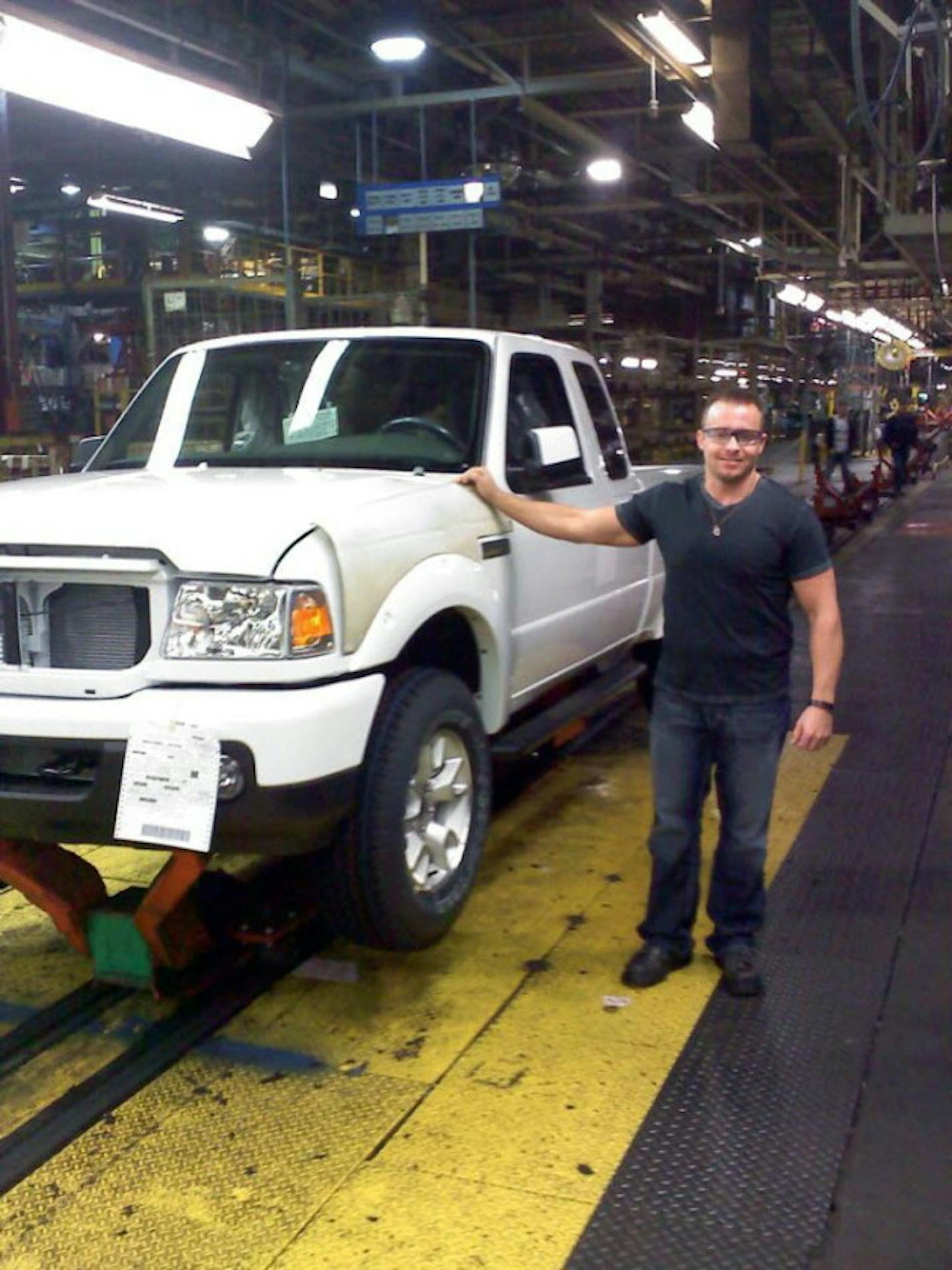 Michael Bartlett stands by the last Ford Ranger vehicle to be built at the St. Paul Ford Plant. PHOTO: submitted by Michael Bartlett