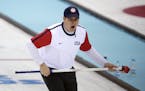 John Shuster, skip of the United States team from Chisholm, Minn., shouted instructions to his sweepers during men's curling competition against Switz