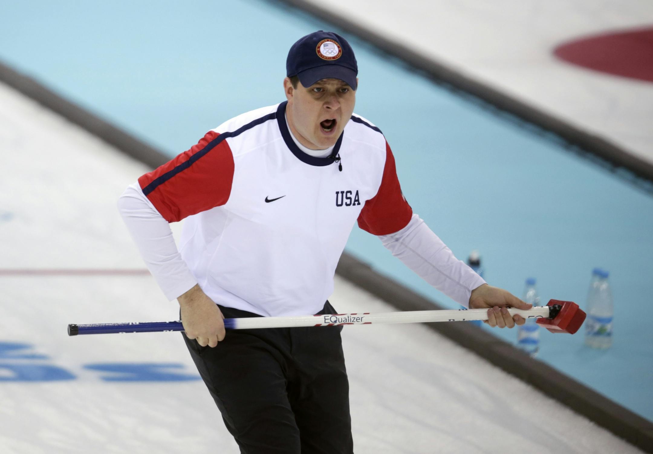John Shuster, skip of the United States team from Chisholm, Minn., shouted instructions to his sweepers during men's curling competition against Switzerland at the 2014 Winter Olympics.