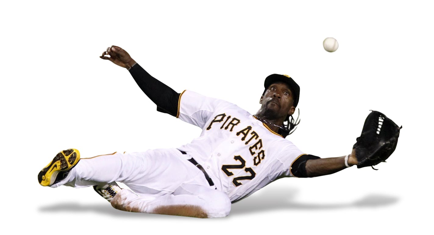 Pittsburgh Pirates center fielder Andrew McCutchen slides but can't come up with the catch on a eleventh inning double by Arizona Diamondbacks' Xavier Nady during a baseball game in Pittsburgh Wednesday, June 8, 2011. The Pirates won in twelve innings 3-2 with McCutchen hitting a walk-off homer. (AP Photo/Gene J. Puskar) ORG XMIT: PAGP109