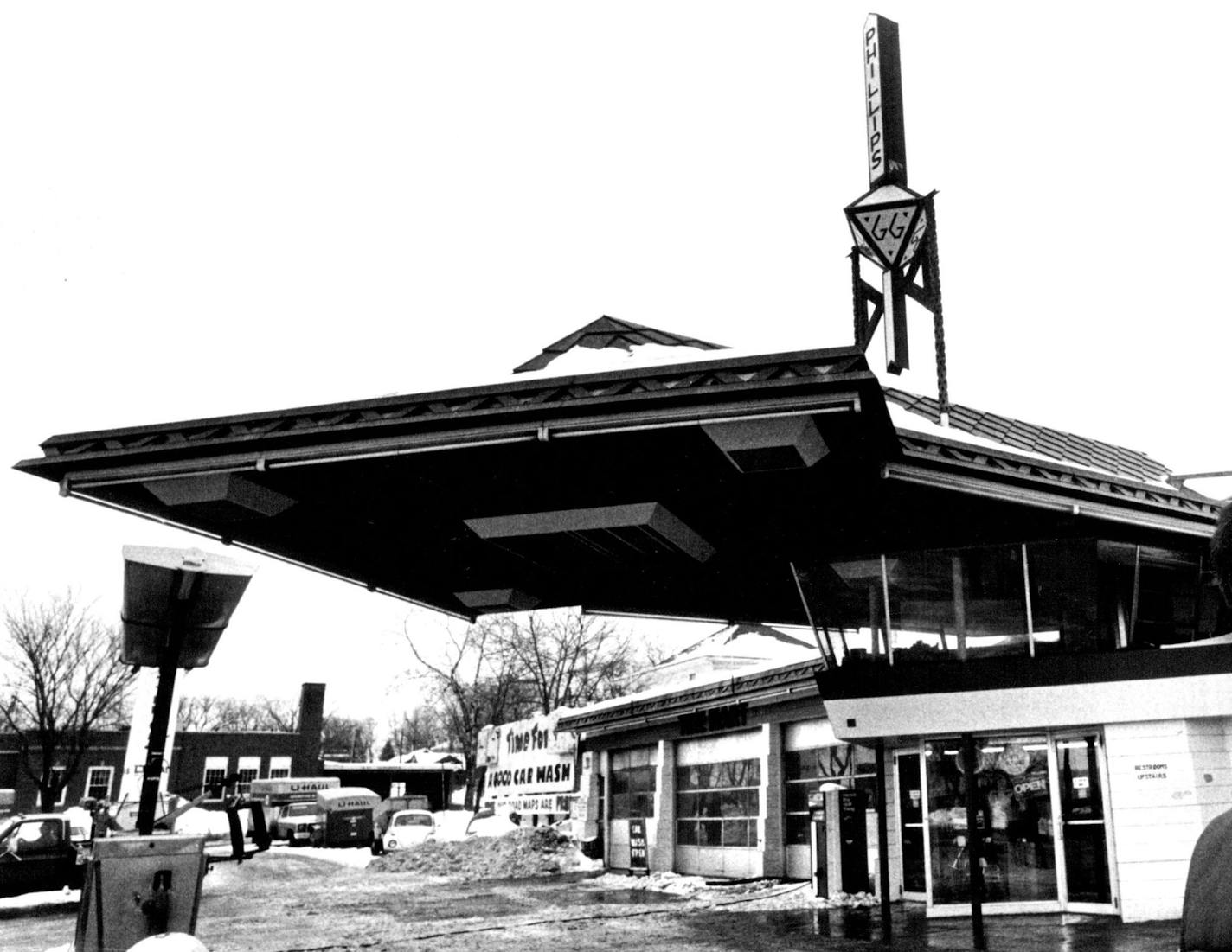 February 19, 1982 The Cloquet, Minn., gas station designed by Frank Lloyd Wright doesnt get raves from its operator, Don Lynch: "The biggest inconvenience is that the restrooms are upstairs." ***** Green with age. Upstairs is a modest glass-encased lounge. And a tower atop the station reaches 60 feet from the ground to display Wrights conception of "66". "They originally planned to have the nozzles pull down from the (canopy), but that was squelched by the fire marshal," Lynch said. February 18,