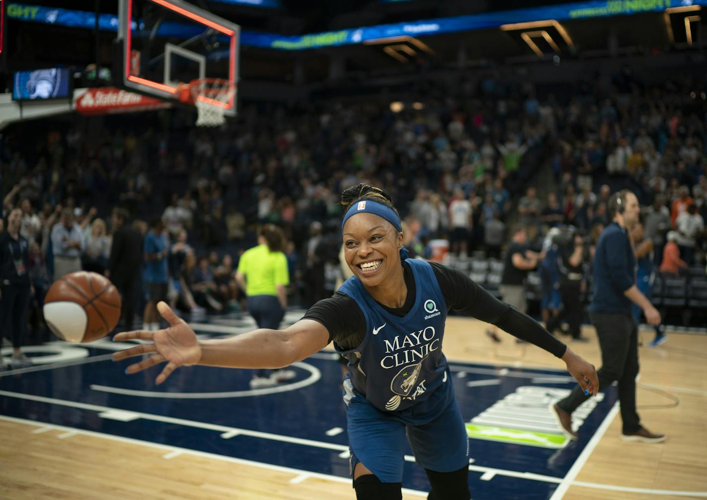 Minnesota Lynx guard Odyssey Sims (1) tossed a miniature ball to a fan courtside after the Lynx won with her 17 point effort. ] JEFF WHEELER • jeff.wheeler@startribune.com The Minnesota Lynx defeated the Indiana Fever 81-73 in an WNBA basketball game Sunday night, September 1, 2019 at Target Center in Minneapolis. ORG XMIT: MIN1909012035585076