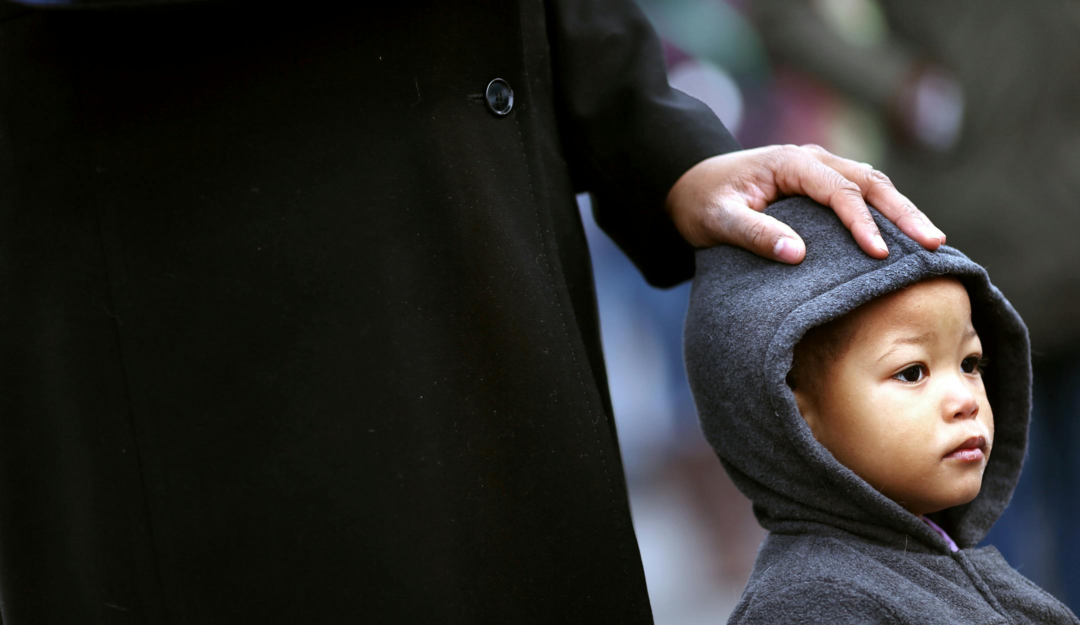 Tina Beavers placed her hand on 2-year grandson Kyeree Beavers head during church services in front of the 4th precinct Sunday November 29, 2015 in Minneapolis, MN.] An outdoor church services was held at the forth precinct on Sunday on Plymouth Ave N. Jerry Holt /Jerry.Holt@Startribune.com