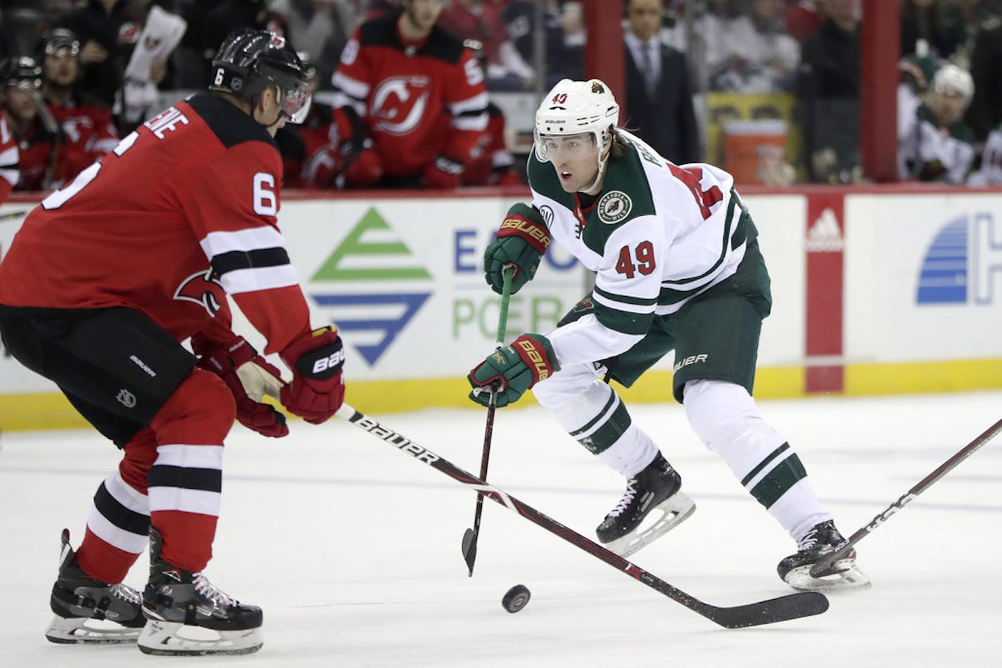 Minnesota Wild center Victor Rask (49), of Sweden, skates against New Jersey Devils defenseman Andy Greene (6) during the first period of an NHL hockey game, Saturday, Feb. 9, 2019, in Newark, N.J. (AP Photo/Julio Cortez)