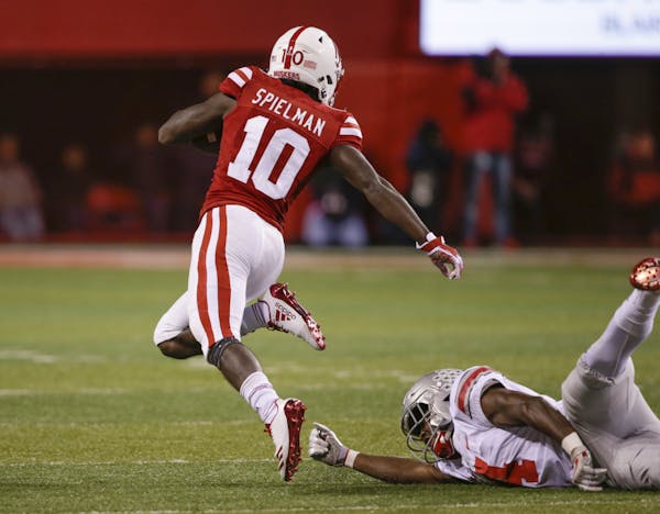Ohio State's Jordan Fuller (4) trips Nebraska wide receiver JD Spielman (10) before he could reach the end zone, during the first half of an NCAA coll