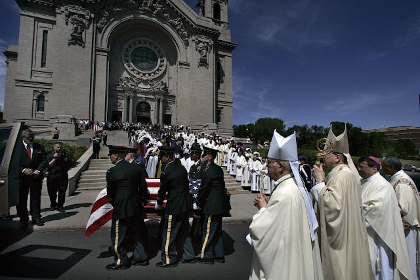 The casket of Father Timothy Vakoc was carried down the front steps of the St. Paul Cathedral following a funeral mass. Clergy (at right) included: Bishop Richard Higgins, Archbishop John C. Nienstedt, Bishop-elect Lee Pich and Deacon Phillip Stewart .