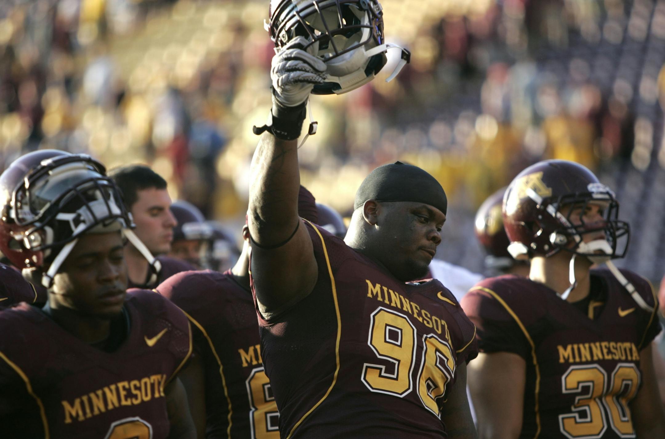 Gopher Brandon Kirksey held his helmet high as the team and fans sang in the end zone at the end of the game at TCF Bank Stadium in Minneapolis, Minn., Saturday, September 10, 2011. New Mexico State won 28-21.
