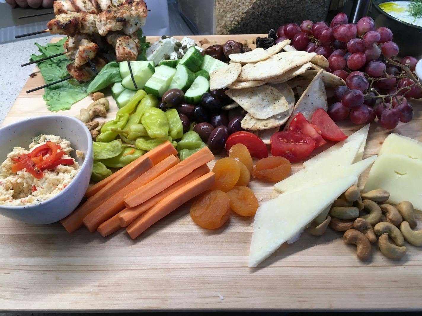 Shareable chicken souvlaki board from It's Greek to Me by Athena in Bat & Barrel at Target Field