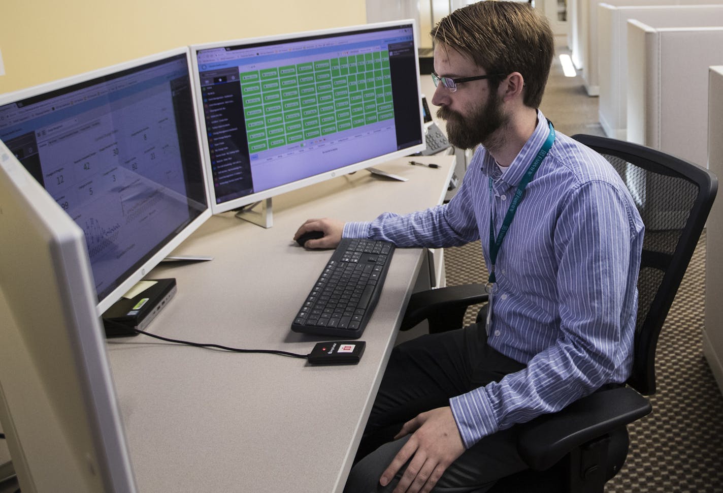 Tyler Schultz worked on a computer in the IT Operations Center at Fairview Health Services on May 31, 2018, in Minneapolis, Minn. The new center will be fully operational with more workers in the coming months. ] RENEE JONES SCHNEIDER &#xef; renee.jones@startribune.com