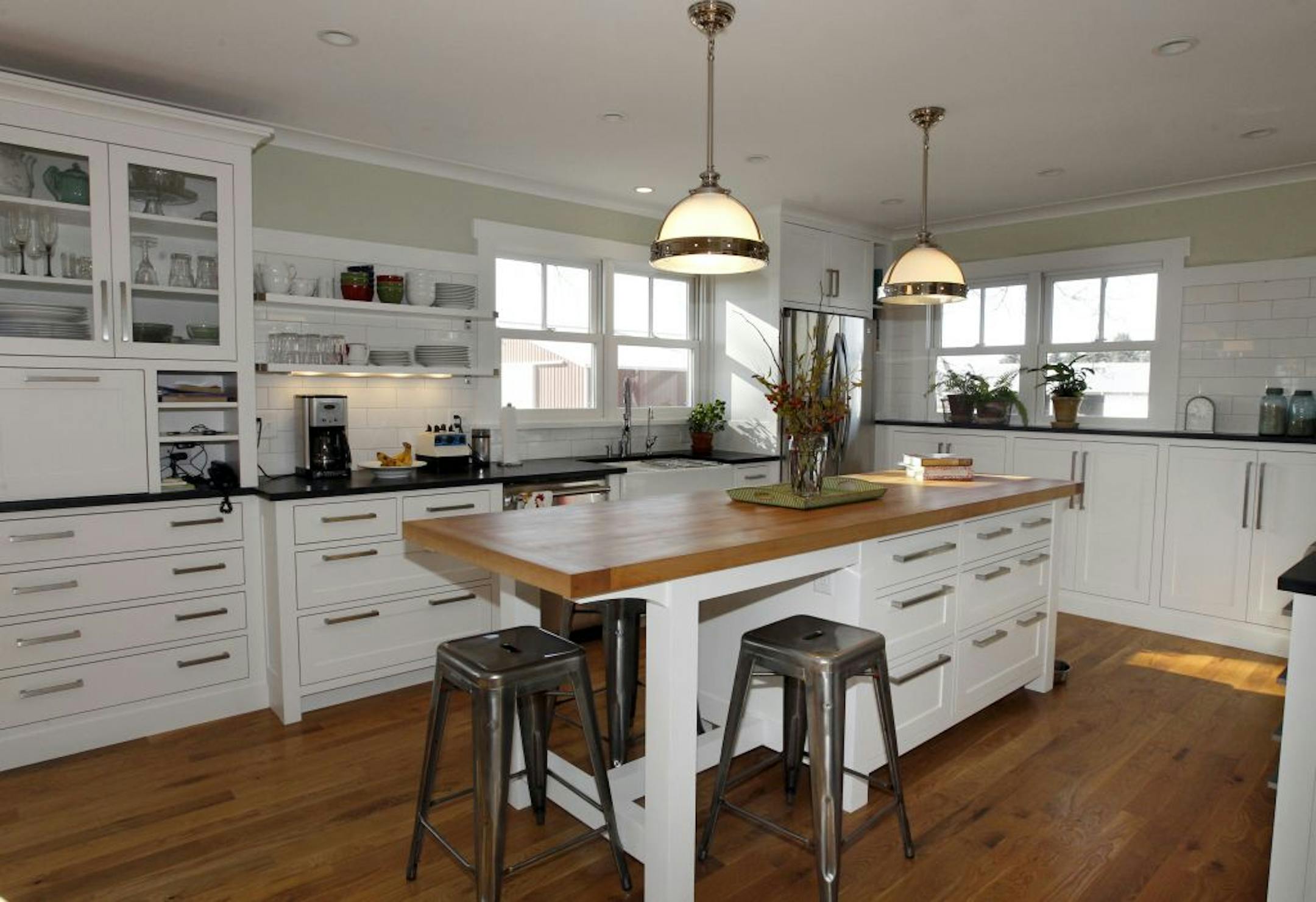 Architect Todd Hansen gave his mother's Hastings farmhouse new life with an addition and remodeled kitchen. The owners Janice and Terry Johnson with her son Todd Hansen. The kitchen area. [ TOM WALLACE • twallace@startribune.com _ Assignments #20020605A_ November 17, 2011_ SLUG: AIAhouse11xx_ EXTRA INFORMATION: Names (CQ) by folks themselves.
