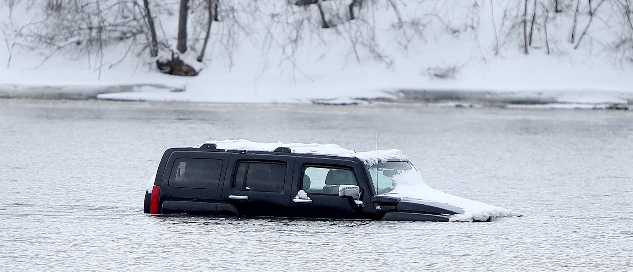 A car sat in the river, Friday, April 4, 2014 in Ramsey.