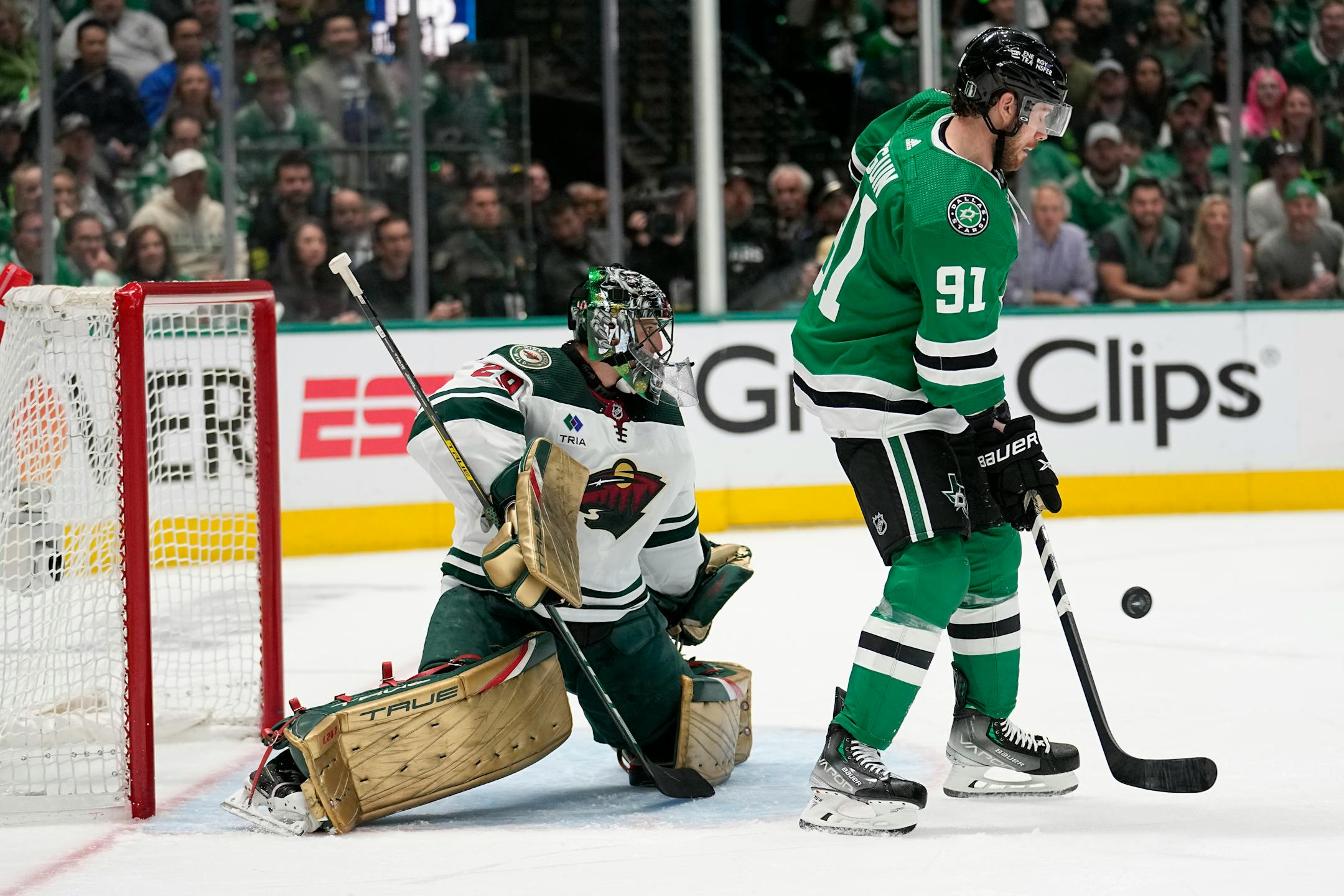 Dallas Stars center Tyler Seguin (91) pressures as Minnesota Wild's Marc-Andre Fleury (29) defends against a shot in the first period of Game 2.