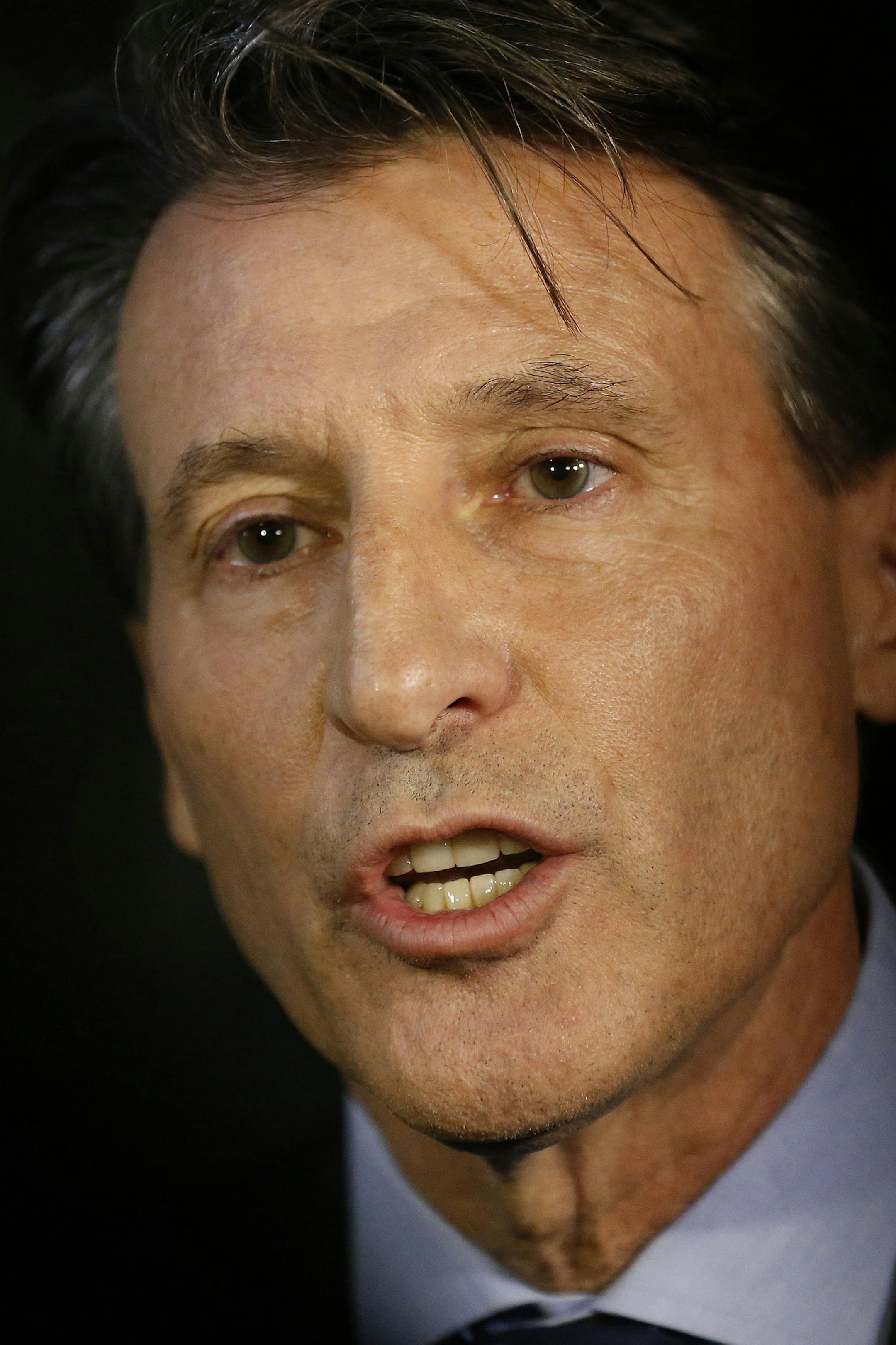 IAAF President Sebastian Coe gives a statement to journalists outside his office in London, Friday, Nov. 13, 2015. Russia's track and field federation has been suspended by governing body IAAF. (AP Photo/Frank Augstein)