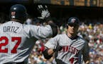 Twins teammates Corey Koskie (47) and David Ortiz in 2002.