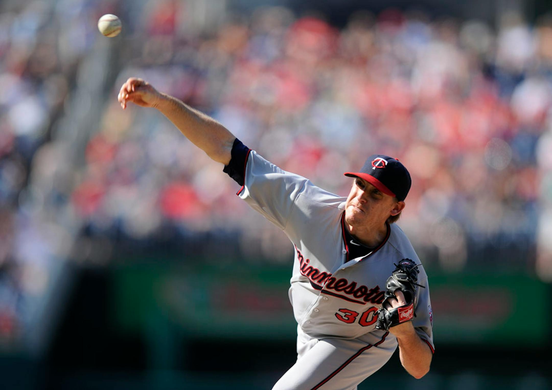 Minnesota Twins starter Kevin Correia delivers a pitch against the Washington Nationals during the third inning of an interleague baseball game.