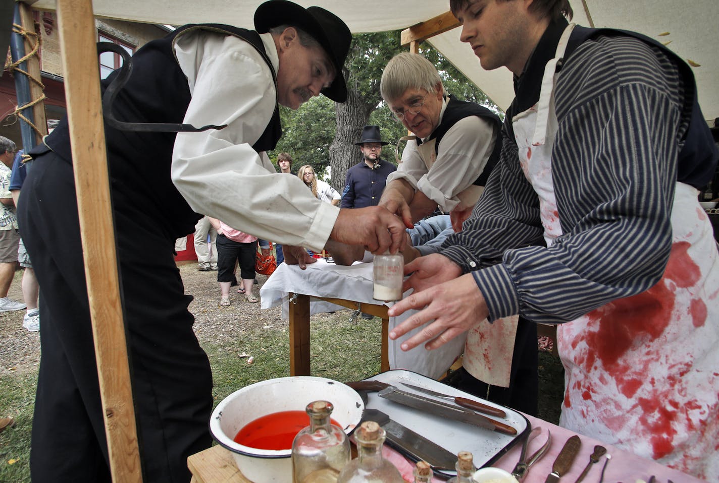 Dakota County's Civil War Weekend with educational demonstrations about Minnesota soldiers who served in the civil war. Gathering held at LeDuc Historic Estate in Hastings. A civil war medical emergency with an operation of a soldier's injured leg was reenacted by chaplin Todd Hein, surgeon Jim Hjermstad and assistant surgeon William Amberg, l-r. (MARLIN LEVISON/STARTRIBUNE(mlevison@startribune.com)