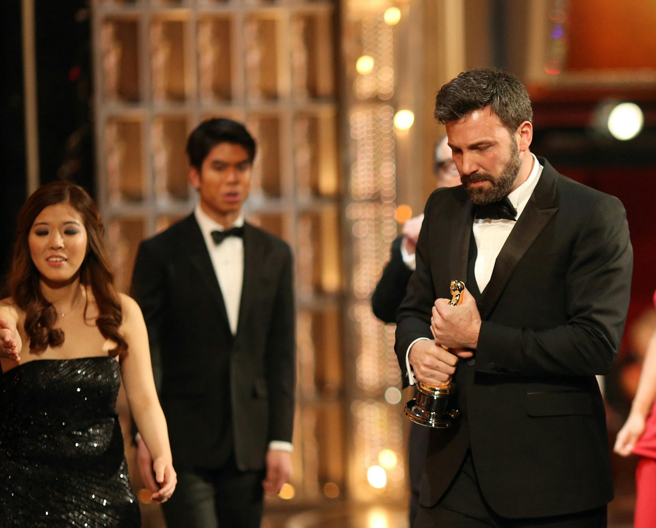 HOLLYWOOD, CA - FEBRUARY 24: Actor-producer-director Ben Affleck walks off stage after winning of the Best Picture award for 'Argo', during the Oscars held at the Dolby Theatre on February 24, 2013 in Hollywood, California. (Photo by Christopher Polk/Getty Images)