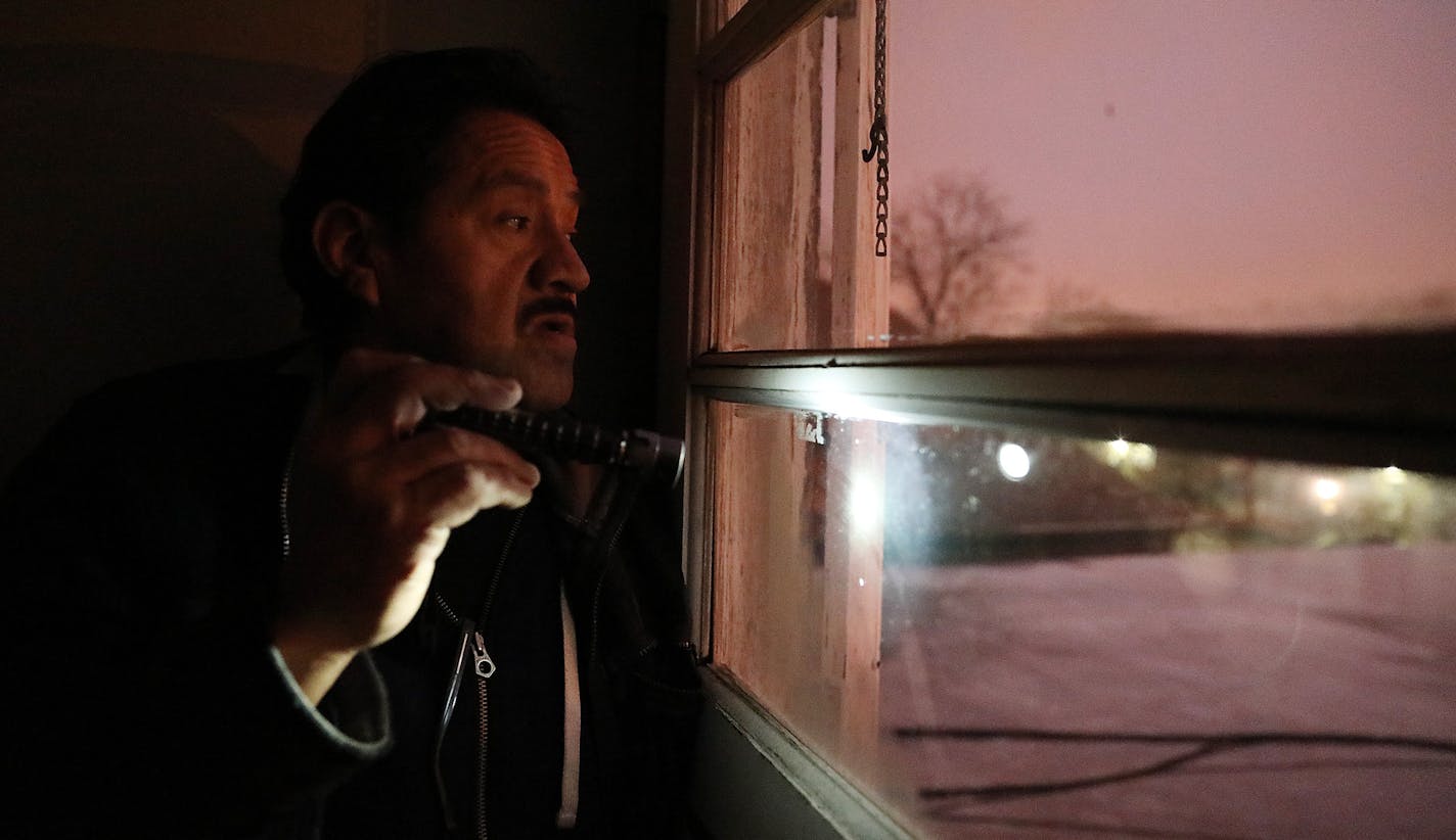 Jose Ramirez uses a flashlight to point out the pools of water on the roof of his apartment building which he says cause water to leak into the units because of inadequate drainage. ] ANTHONY SOUFFLE &#x2022; anthony.souffle@startribune.com Jose Ramirez and his wife live in an apartment building owned by landlord Stephen Frenz who the city is trying to strip of all his rental licenses. The Ramirez's roof leaks, there's been prostitution in the hallways, and their oven randomly turns on.