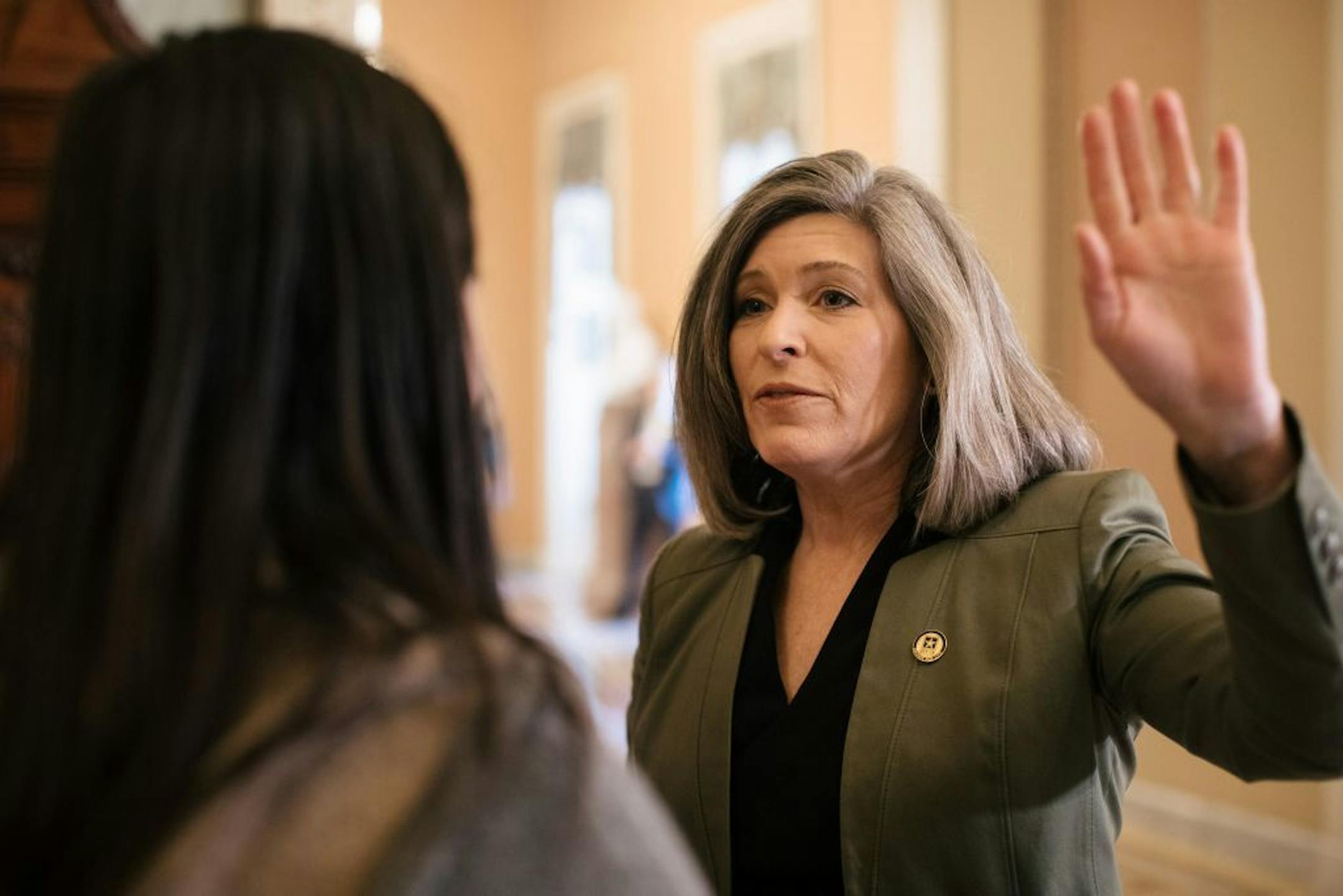 Sen. Joni Ernst (R-Iowa) speaks to reporters before the Senate impeachment trial resumes at the Capitol in Washington on Thursday, Jan. 30, 2020.