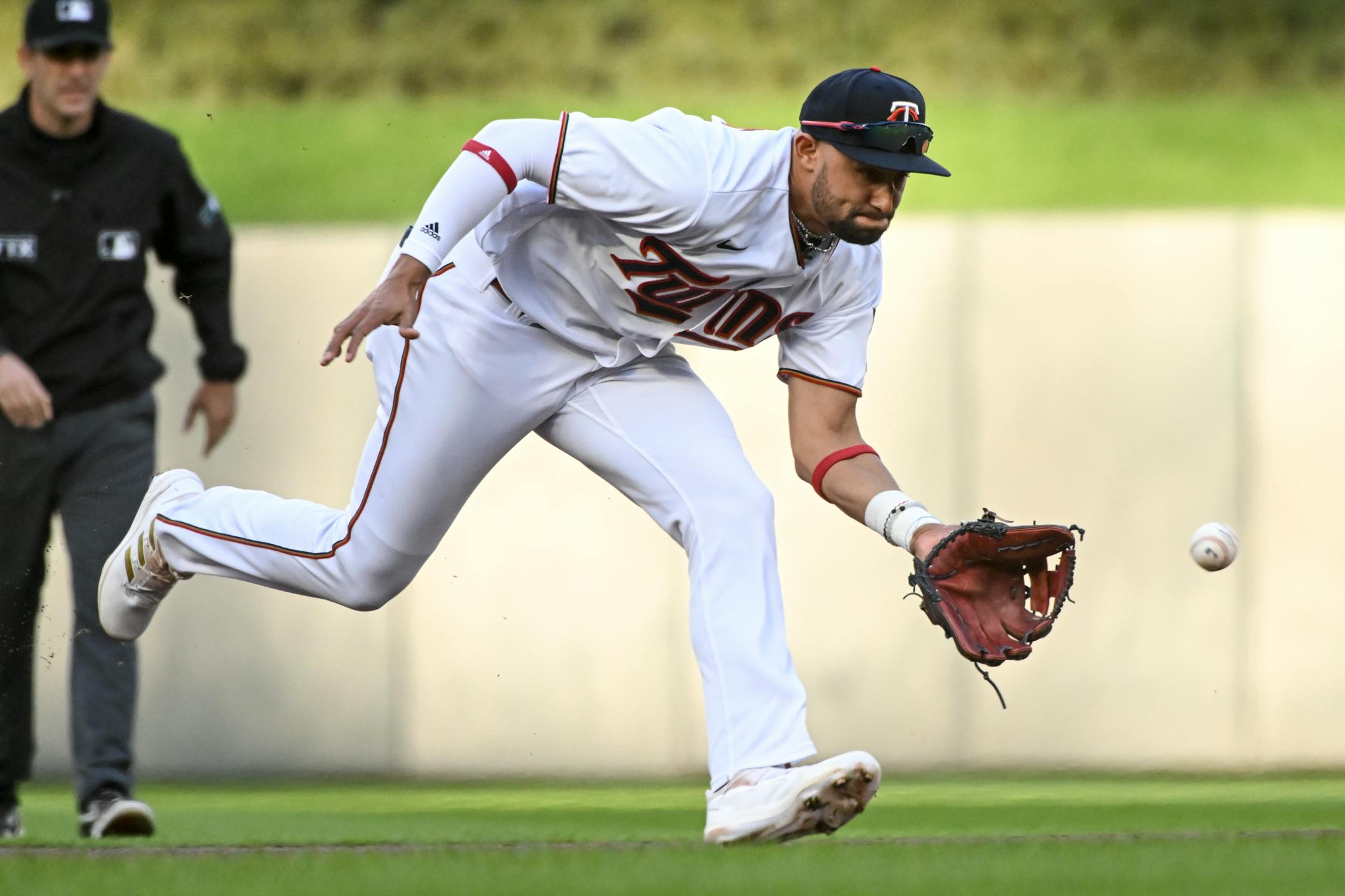 Oakland Athletics first baseman Sheldon Neuse (26) grounds out to Minnesota Twins shortstop Royce Lewis (23) during the top of the first inning.