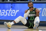 Minnesota Timberwolves guard Mike Conley (10) gestures in the first half of an NBA basketball game against the Memphis Grizzlies, Sunday, Nov. 26, 202