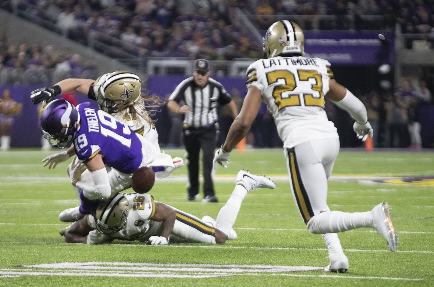 Minnesota Vikings wide receiver Adam Thielen (19) fumbled the ball in the second quarter after hit was hit by Saints P.J. Williams.