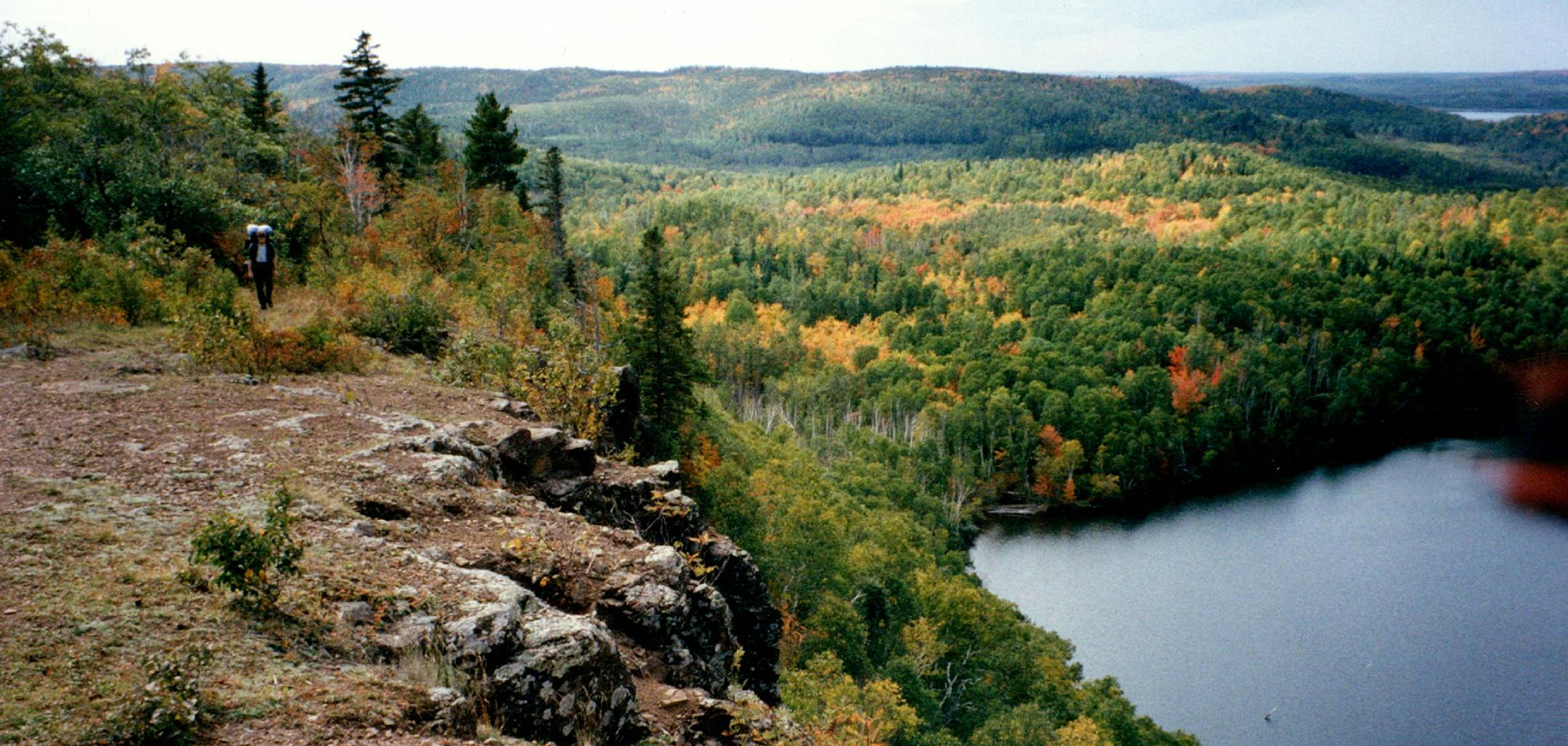 October 2, 1994 A hiker mounted Fault Line Ridge overlooking a lake hundreds of feet below. Warren Wolfe , Minneapolis Star Tribune ORG XMIT: MIN2017012819455827