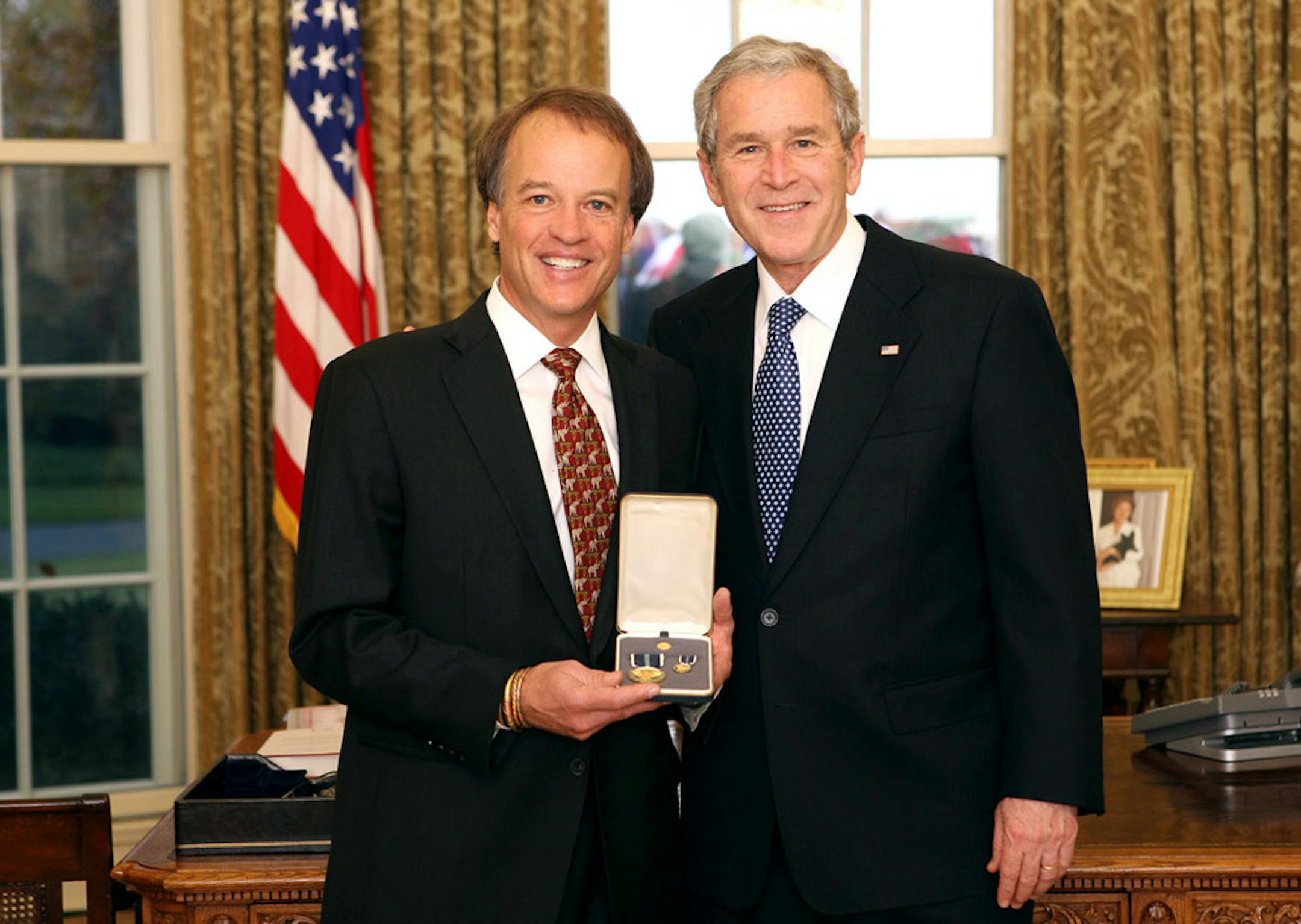 President George W. Bush stands with Ward Brehm, of Wayzata, Minn., after presenting him with the 2008 Presidential Citizens Medal Wednesday.