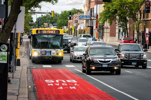 A Metro Transit bus drove north on Hennepin Avenue in a dedicated bus lane toward the Uptown Transit Station. 