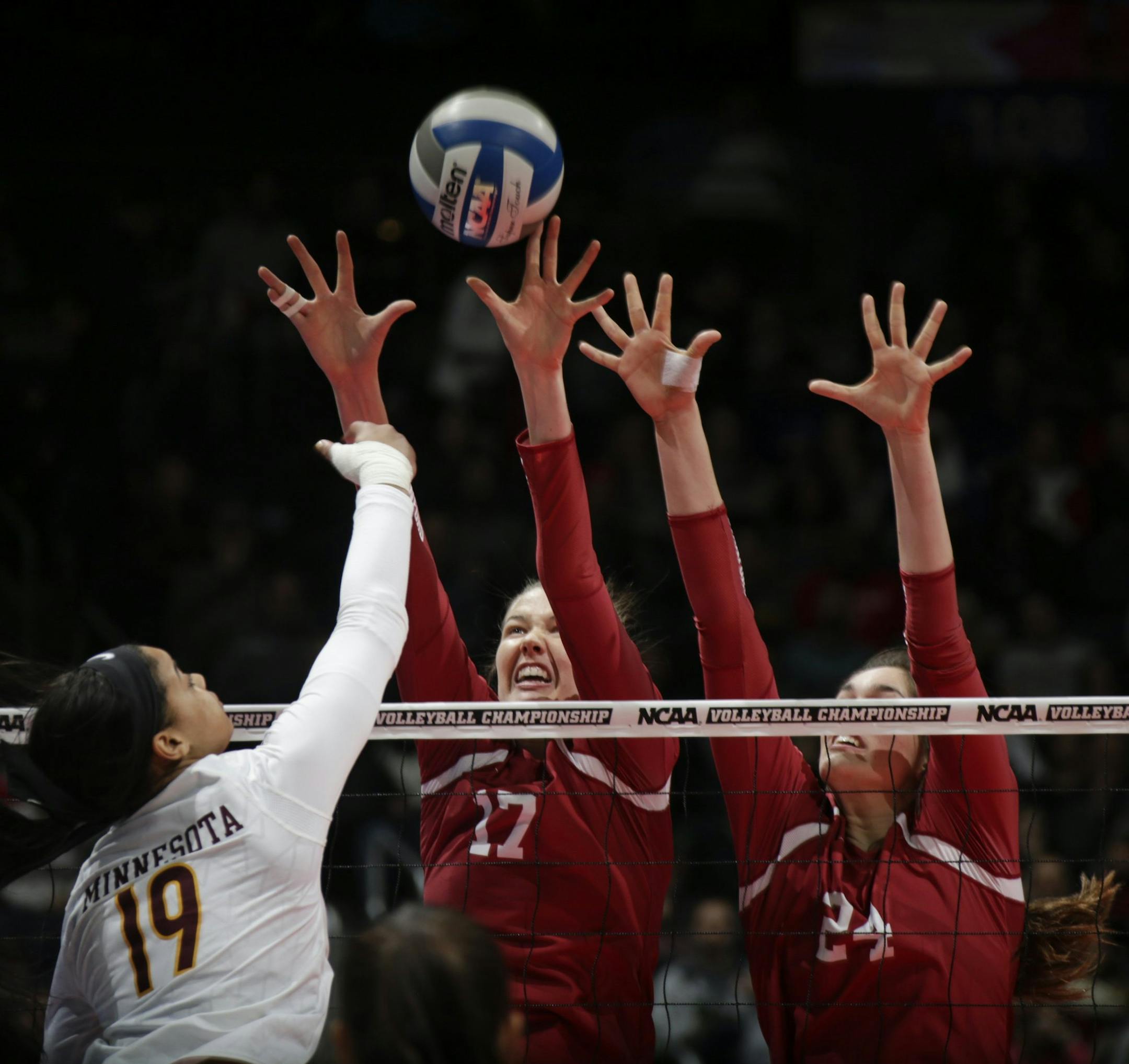 Stanford's Merete Lutz (17) and Audriana Fitzmorris (24) attempt a block on a shot from Minnesota's Alexis Hart (19) during the first set of an NCAA women's volleyball national semifinal at Nationwide Arena in Columbus, Ohio, on Thursday, Dec. 15, 2016. (Joshua A. Bickel/Columbus Dispatch/TNS)