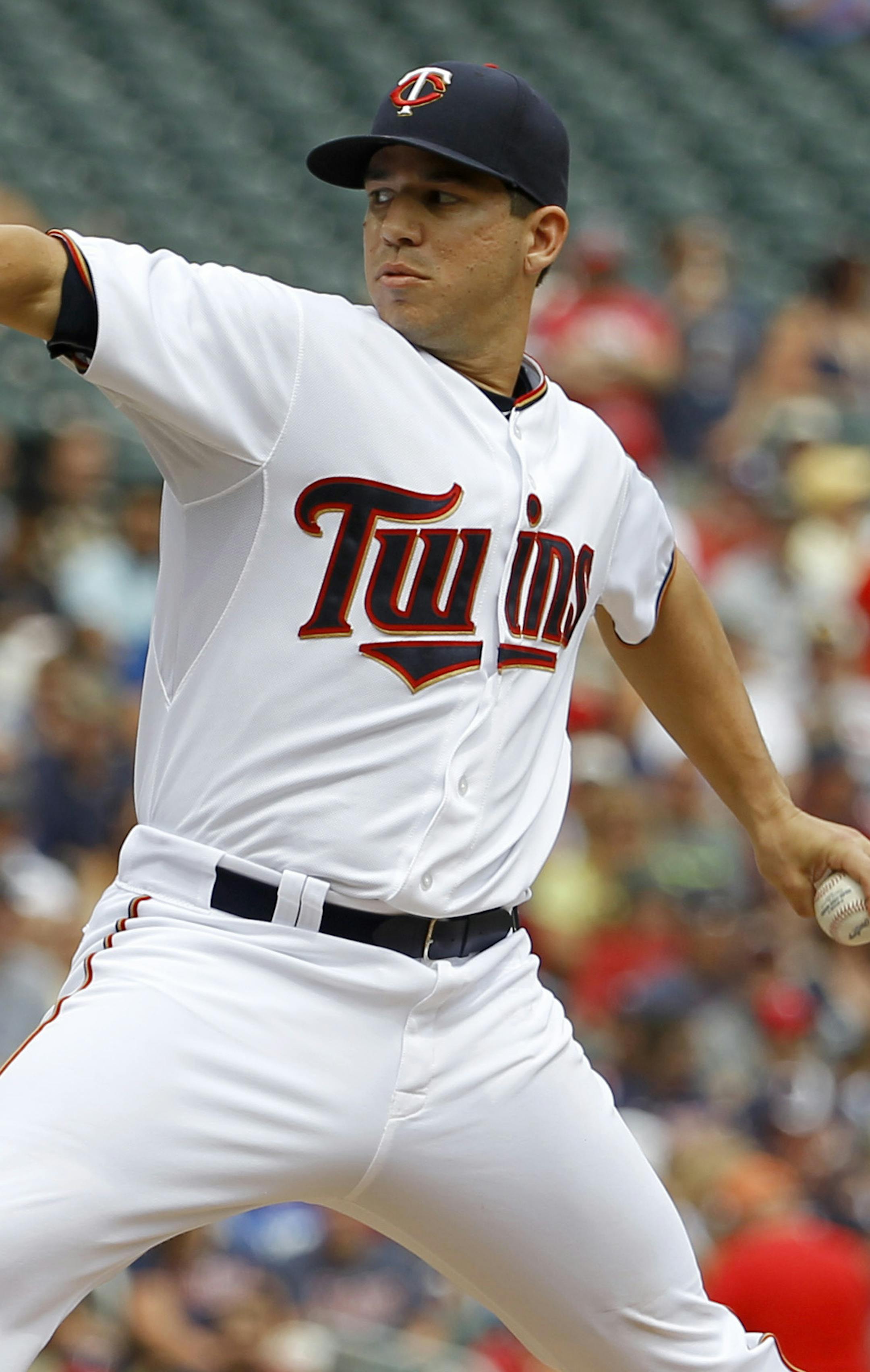 Minnesota Twins starting pitcher Tommy Milone delivers to the Cleveland Indians during the first inning of a baseball game in Minneapolis, Sunday, Aug. 16, 2015. (AP Photo/Ann Heisenfelt)