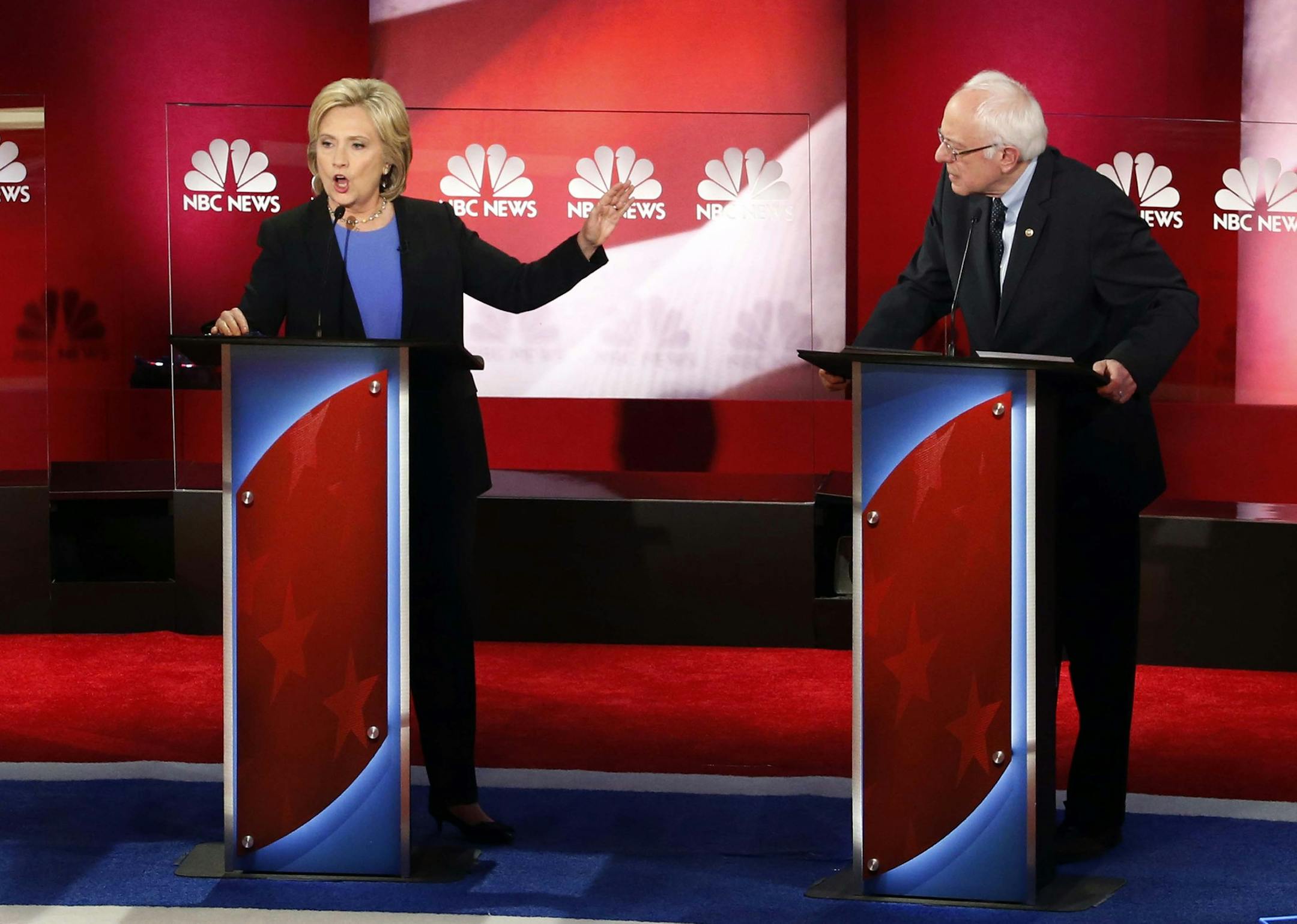 Democratic presidential candidate, Hillary Clinton, left, speaks at the NBC, YouTube Democratic presidential debate at the Gaillard Center, Sunday, Jan. 17, 2016, in Charleston, S.C. To the right is Democratic presidential candidate, Sen. Bernie Sanders, I-Vt. (AP Photo/Stephen B. Morton)