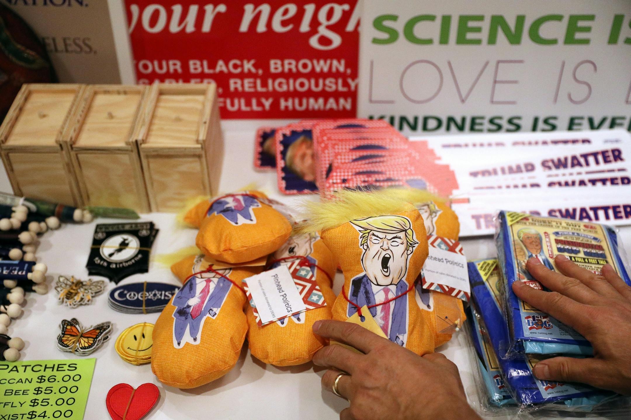 Trentt Cramer of Minneapolis arranged pin cushion figures of President Donald Trump during the DFL State Convention Friday.