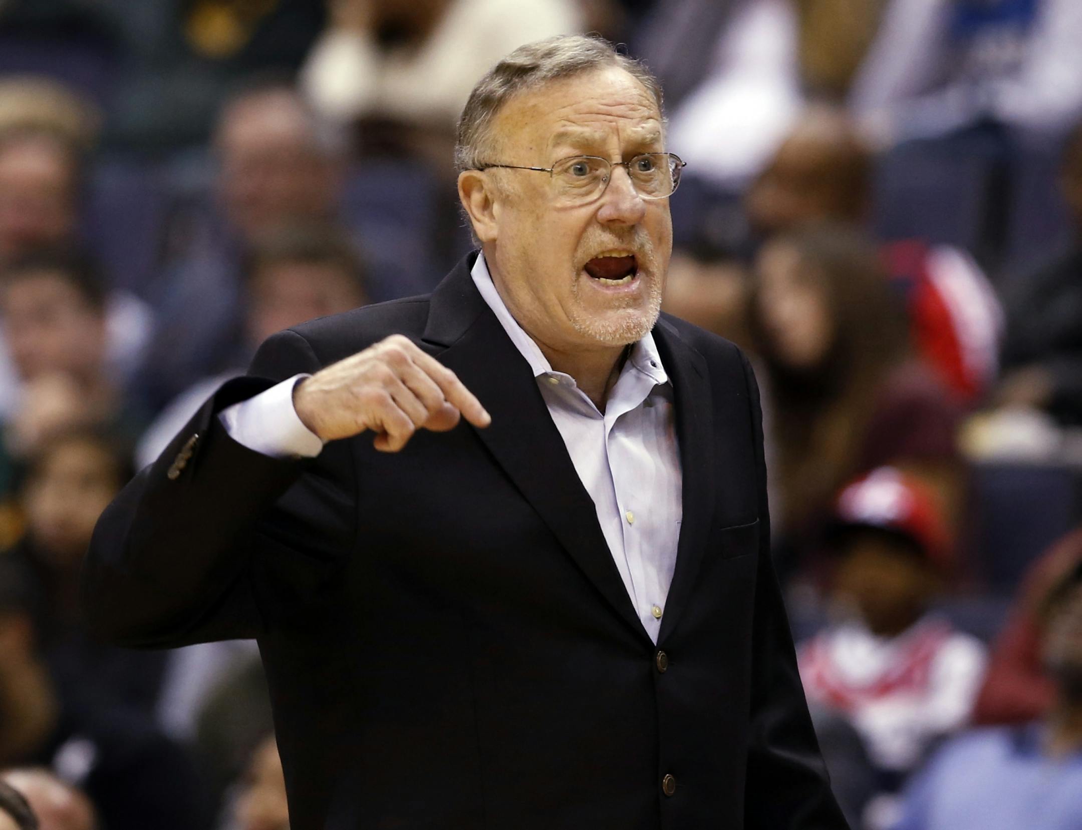Minnesota Timberwolves head coach Rick Adelman questions an officials' call in the first half of an NBA basketball game against the Washington Wizards Tuesday, Nov. 19, 2013, in Washington. The Wizards won 104-100.