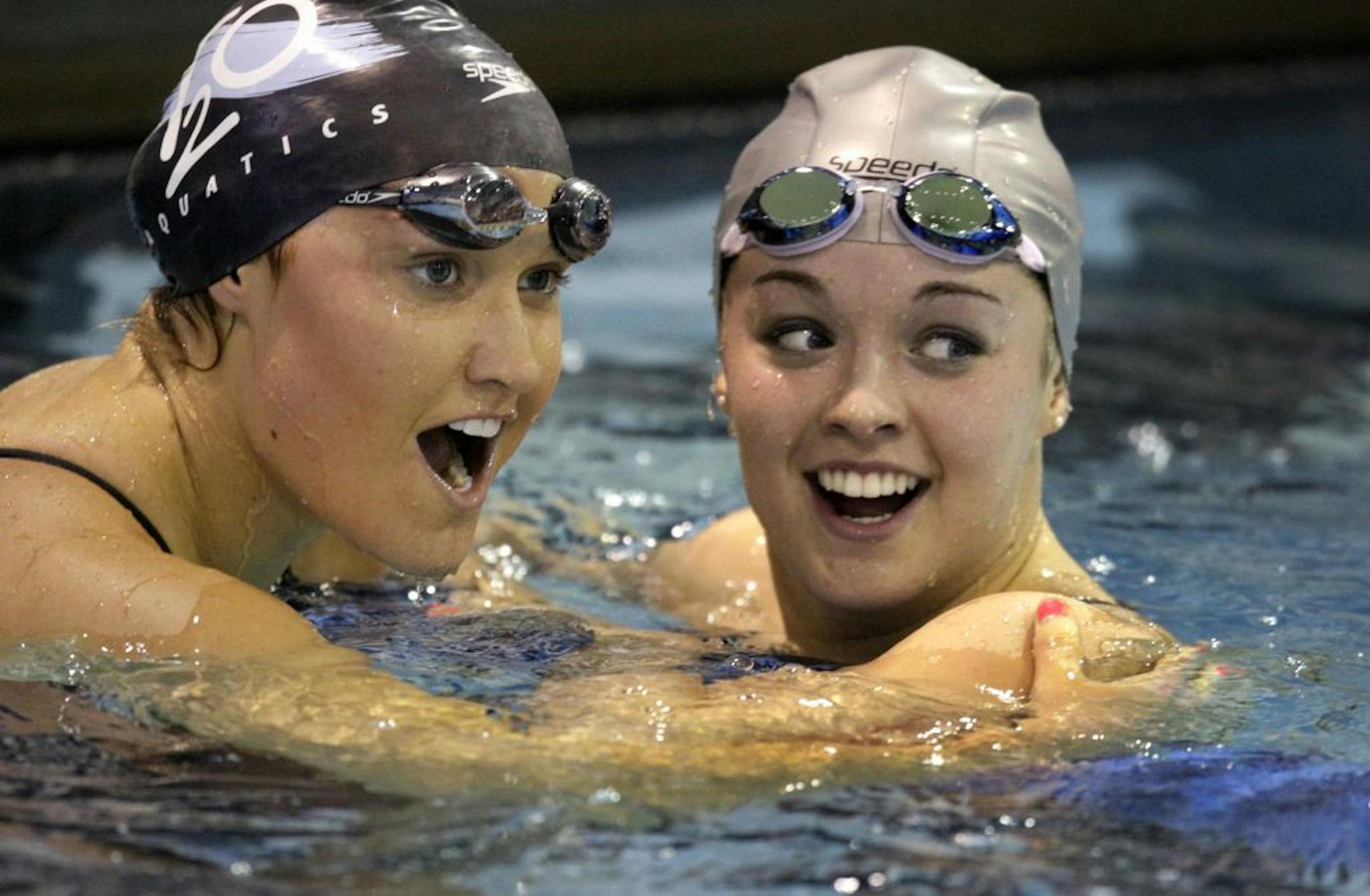 Rachel Bootsma, right, celebated with close friend Elizabeth Pelton after they tied for first in the 100-meter backstroke final in the Charlotte UltraSwim meet earlier this month.