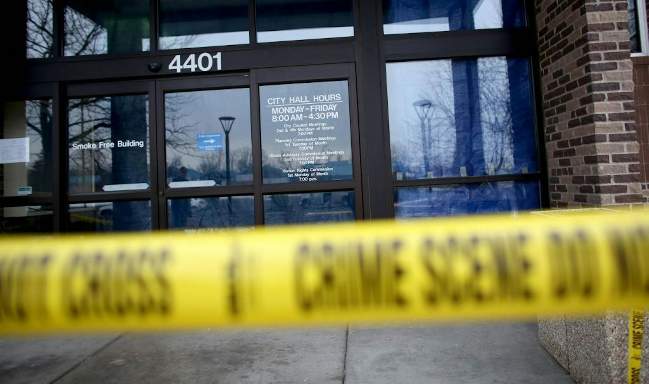 Police tape closed off the entrance to the New Hope City Hall after gunfire erupted outside the Monday city council meeting.