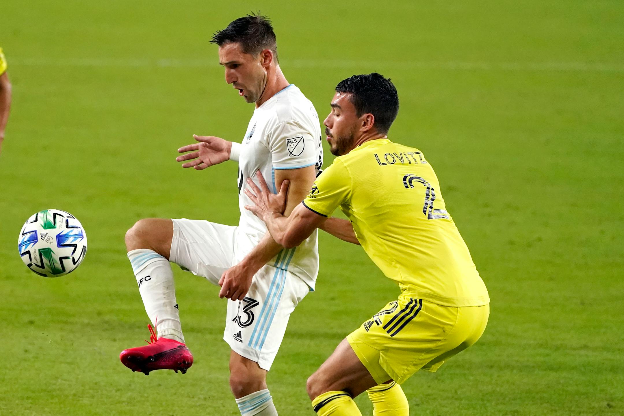 Minnesota United midfielder Ethan Finlay (13) dribbled past Nashville defender Daniel Lovitz (2) during an Oct. 6 match. United's scheduled game at FC Dallas on Sunday night wasn't played because two Loons first-team players tested confirmed positive for COVID-19.